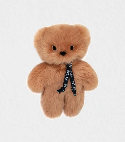 Close-up of the plush baby bear’s velvety Maïloudou fur and embroidered features showcasing its handmade craftsmanship—plush baby bear Dubai baby gift shipped worldwide.