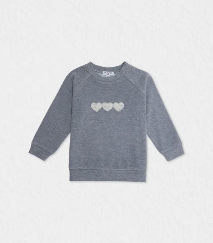 girls washed blue sweater